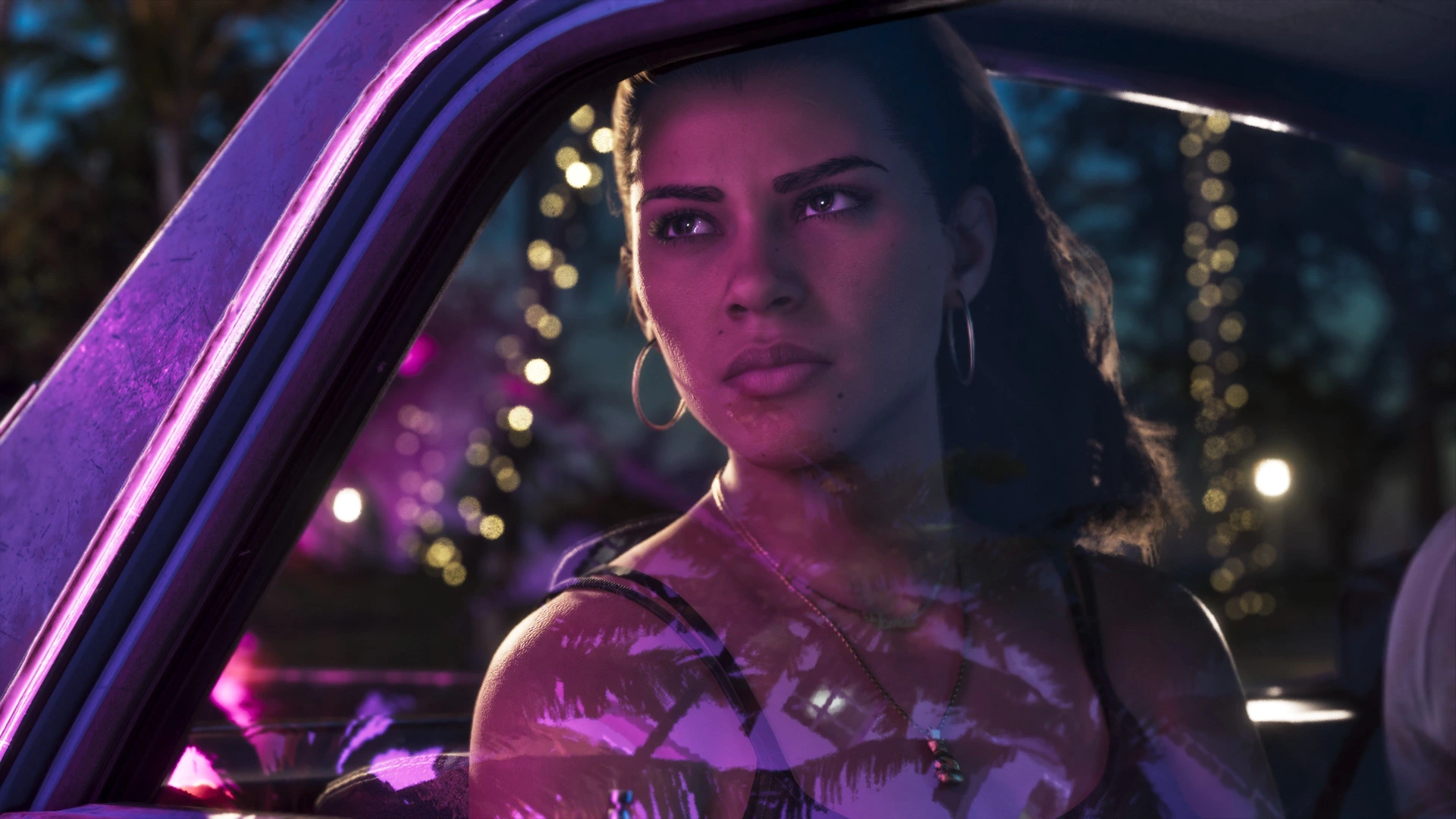 Lucia Caminos inside a car at night, pink Vice City neon reflected on the window in GTA 6