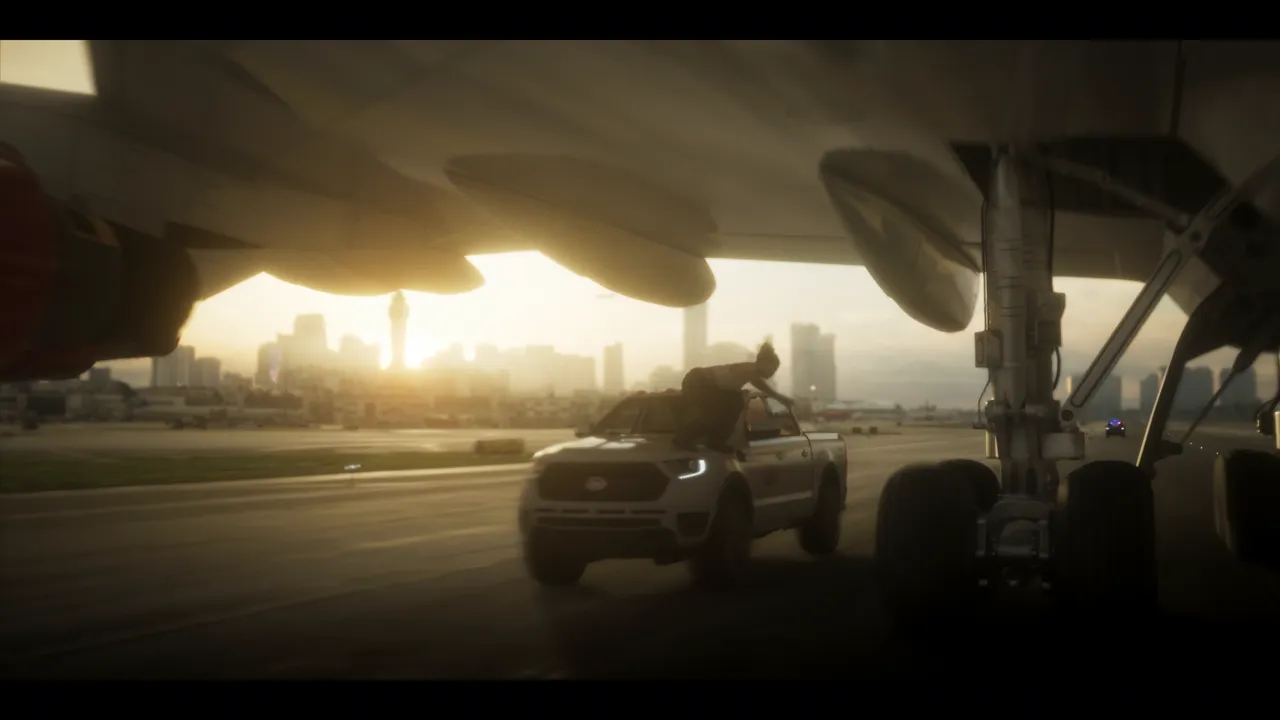 At sunset, a pickup drives down a runway under the fuselage and landing gear of a plane, a figure on its roof, towers on the horizon.